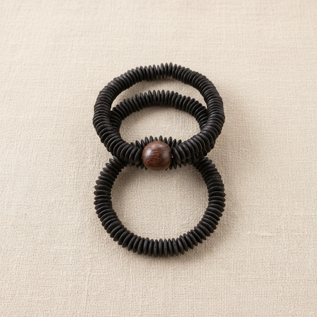 Mekong Stack — three handcrafted coconut shell bracelets with carved wood focal bead center