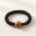 Mekong Bracelet Carved Wood — handcrafted coconut shell bracelet with carved wood focal bead