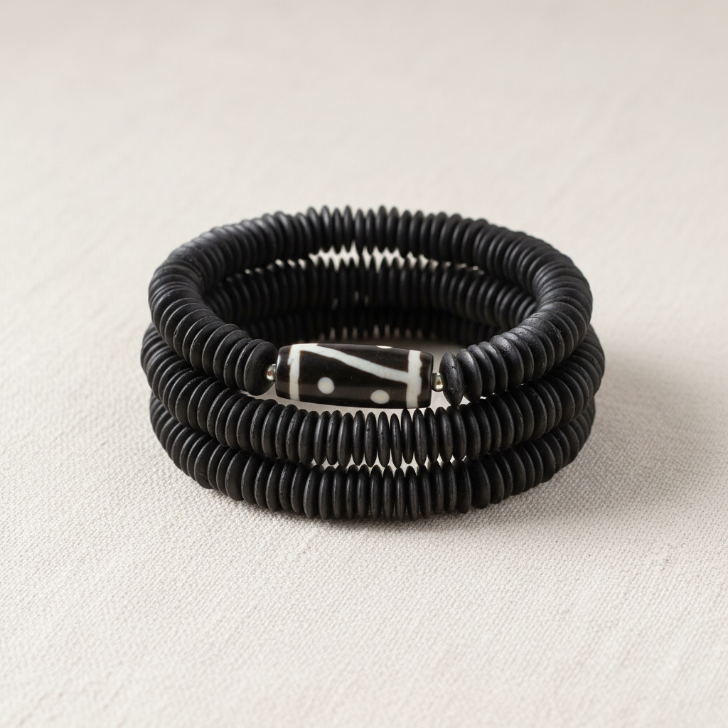 Mekong Stack — three handcrafted coconut shell bracelets with Dzi stone focal bead center