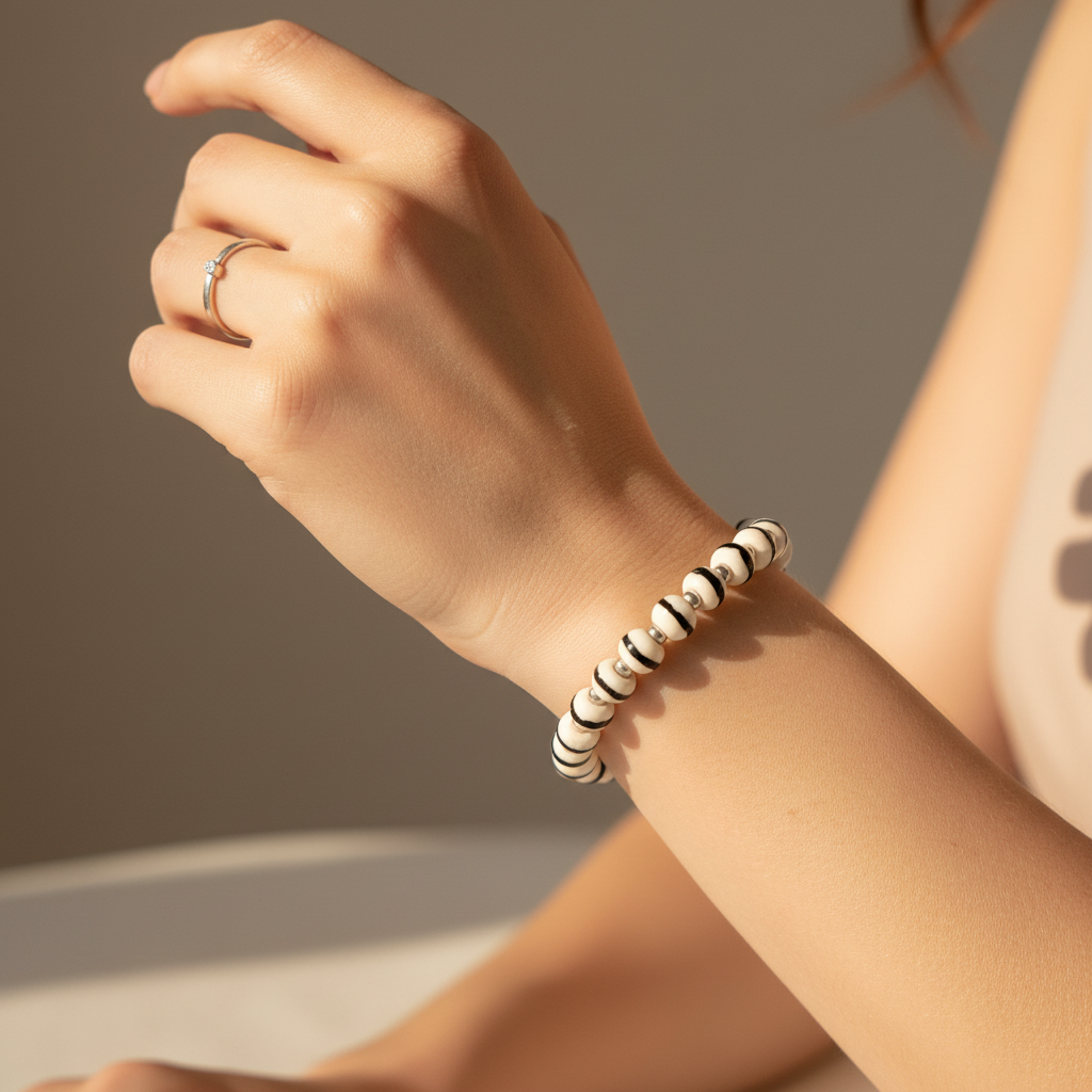 White Zen Bracelet worn on woman's wrist