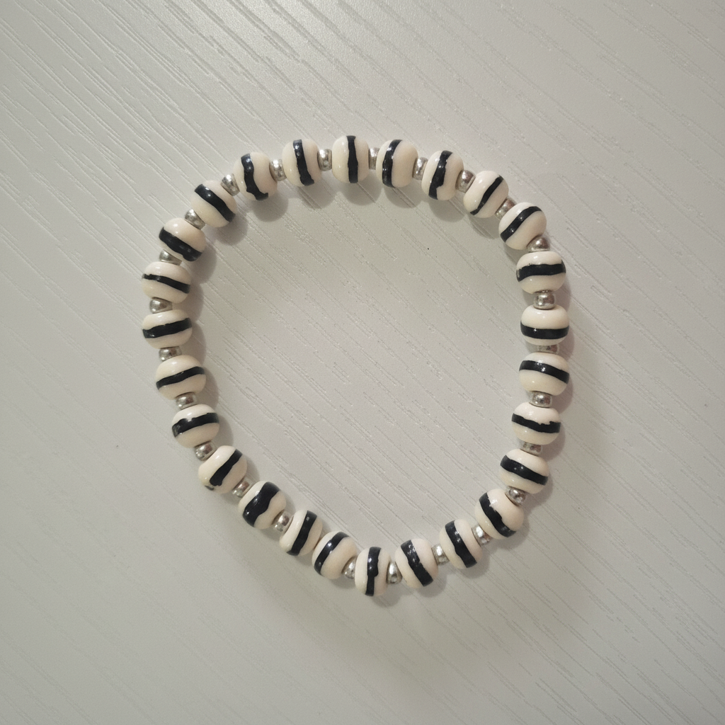 White Zen Bracelet clean flat lay on cream background