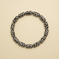 Black Totem Bracelet flat lay on cream background