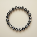 Midnight Swirl Bracelet flat lay on cream background